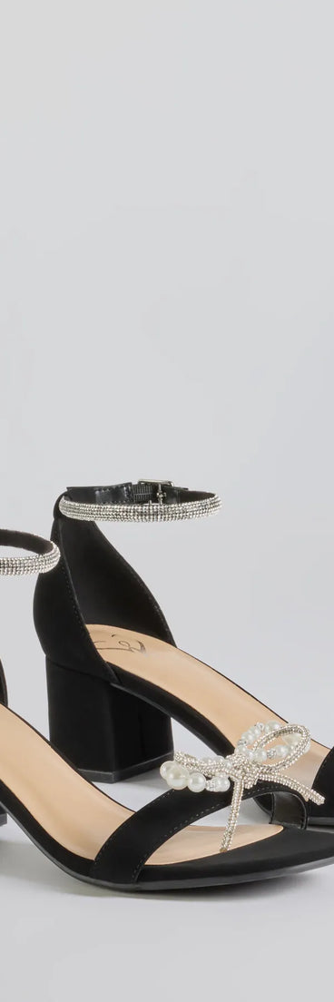 The Dazzling Rhinestone Faux Pearl Bow Block Heels are versatile prom shoes designed for comfort and style, making them perfect for a night of celebration. Available in Black.