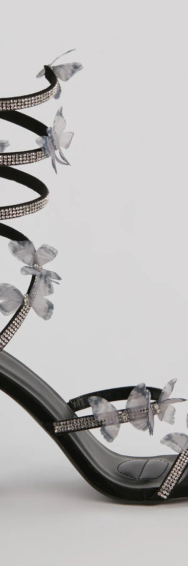 Elevate warm-weather looks with Mythical Babe Butterfly Rhinestone Spiral Stiletto Heels in black, a pair of trendy sandals bringing chic, modern flair to every step.
