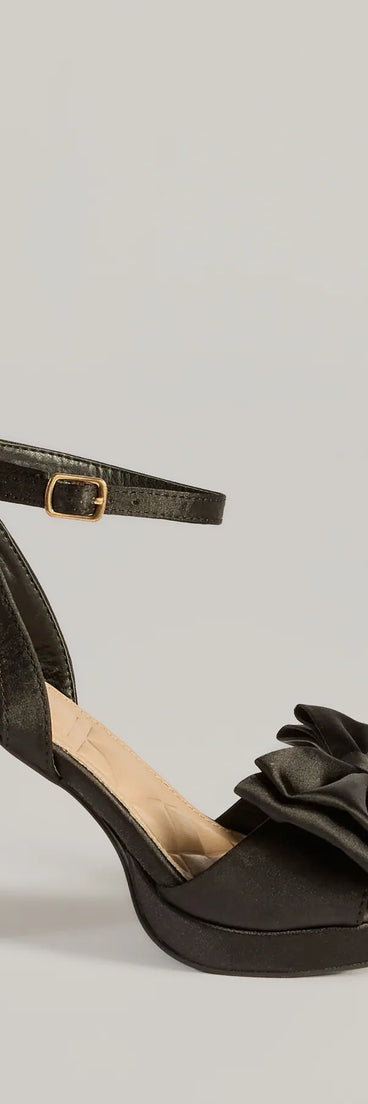 The Icon Era Satin Bow Strap Platform Heels in black is an elevated pick for your best outfit yet, effortlessly delivering a polished look that's sure to turn heads at any celebration.