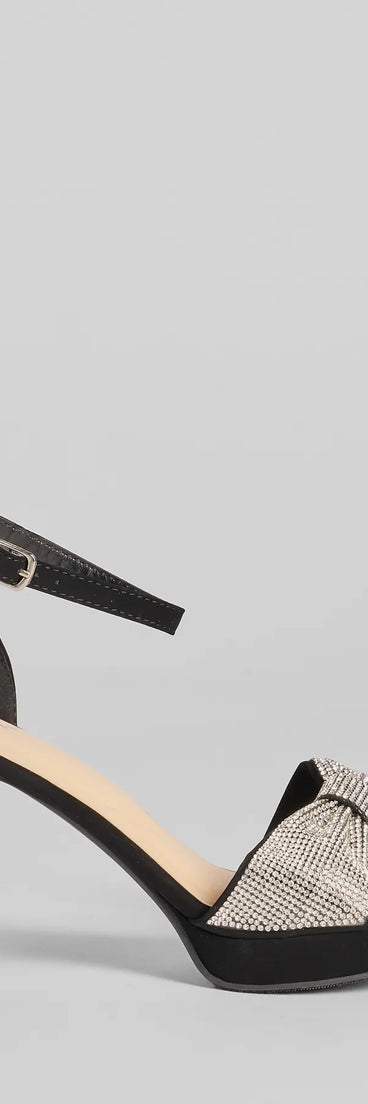 Elevate warm-weather looks with Gift Of Glam Rhinestone Bow Strap Platform Heels in black, a pair of trendy sandals bringing chic, modern flair to every step.