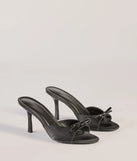 Elevate your work wardrobe with the Chic Elegance Faux Leather Stiletto Bow Mules in black, a versatile women's shoe perfect for the office; that combines style with comfort for seamless desk-to-dinner transitions.