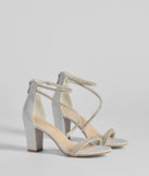 The Reigning In Rhinestone Asymmetrical Strap Glitter Heels in silver brings sleek style to any graduation outfit, from cap and gown to after-party.