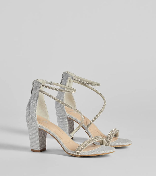 The Reigning In Rhinestone Asymmetrical Strap Glitter Heels in silver brings sleek style to any graduation outfit, from cap and gown to after-party.