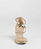The Pure Magic Rhinestone Metallic Block Heels in gold brings sleek style to any graduation outfit, from cap and gown to after-party.