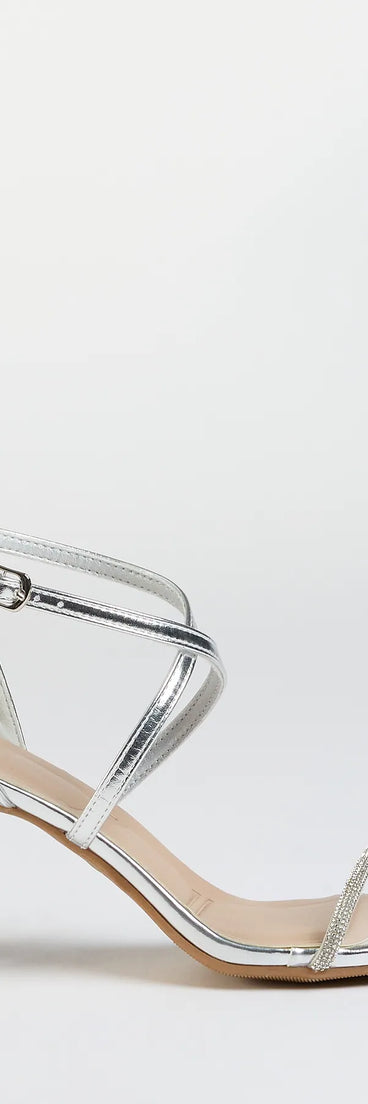 Elevate warm-weather looks with In The Limelight Rhinestone Strap Metallic Heels in silver, a pair of trendy sandals bringing chic, modern flair to every step.