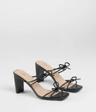 The Finest Hour Bow Strappy Mules in black brings sleek style to any graduation outfit, from cap and gown to after-party.