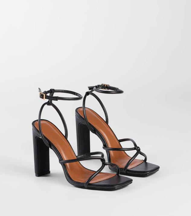 The So Elegant Twist Strappy Block Heels in black brings sleek style to any graduation outfit, from cap and gown to after-party.
