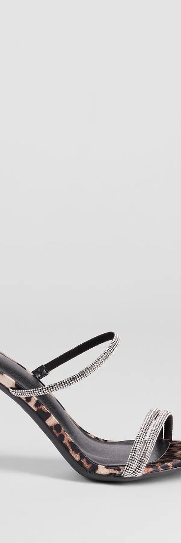 Elevate warm-weather looks with Wild Luxe Leopard And Rhinestone Stiletto Heels in leopard print, a pair of trendy sandals bringing chic, modern flair to every step.