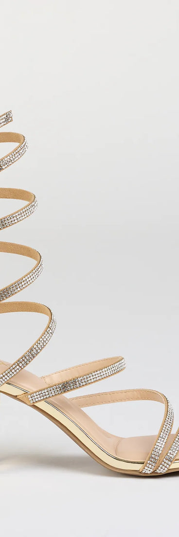 Elevate warm-weather looks with Elevated Status Rhinestone Spiral Block Heels in gold, a pair of trendy sandals bringing chic, modern flair to every step.