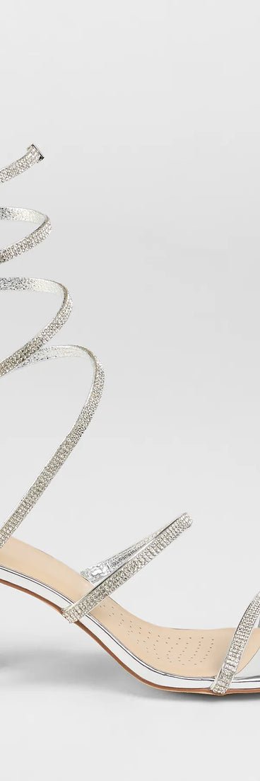 Elevate warm-weather looks with Sparkle And Shine Rhinestone Spiral Block Heels in silver, a pair of trendy sandals bringing chic, modern flair to every step.