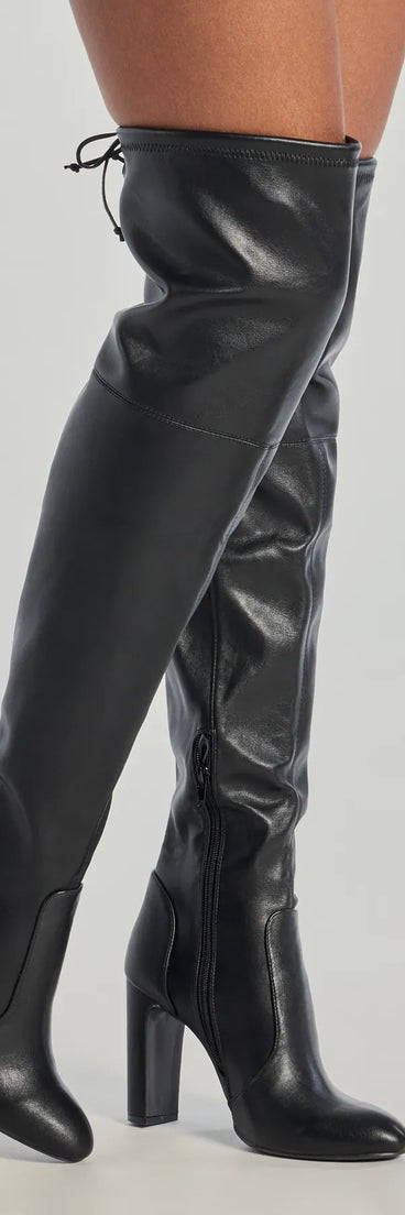 Sleek Look Thigh-High Block Heel Boots, a trendy black addition to women's going-out outfits, is ideal for Christmas party outfits, chic NYE attire, or winter night-out looks that keep you on-trend!