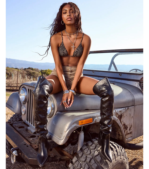 The Sleek Western Vibe Thigh High Cowboy Boots in black brings edge and energy to your vibe, ready to elevate any festival look or concert outfit.