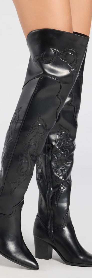 The Sleek Western Vibe Thigh High Cowboy Boots in black brings edge and energy to your vibe, ready to elevate any festival look or concert outfit.