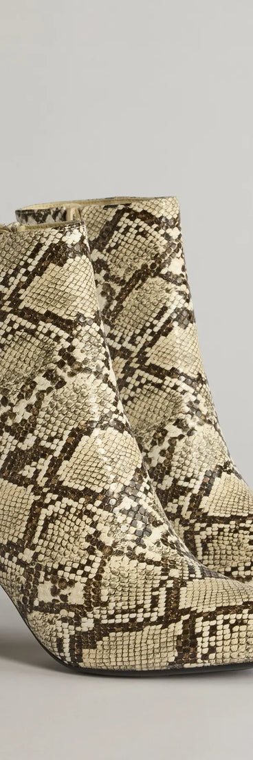 So Fierce Faux Leather Snake Print Ankle Booties, a trendy snake print addition to women's going-out outfits, is ideal for Christmas party outfits, chic NYE attire, or winter night-out looks that keep you on-trend!