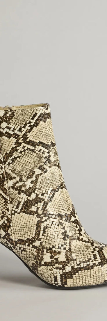 So Fierce Faux Leather Snake Print Ankle Booties, a trendy snake print addition to women's going-out outfits, is ideal for Christmas party outfits, chic NYE attire, or winter night-out looks that keep you on-trend!