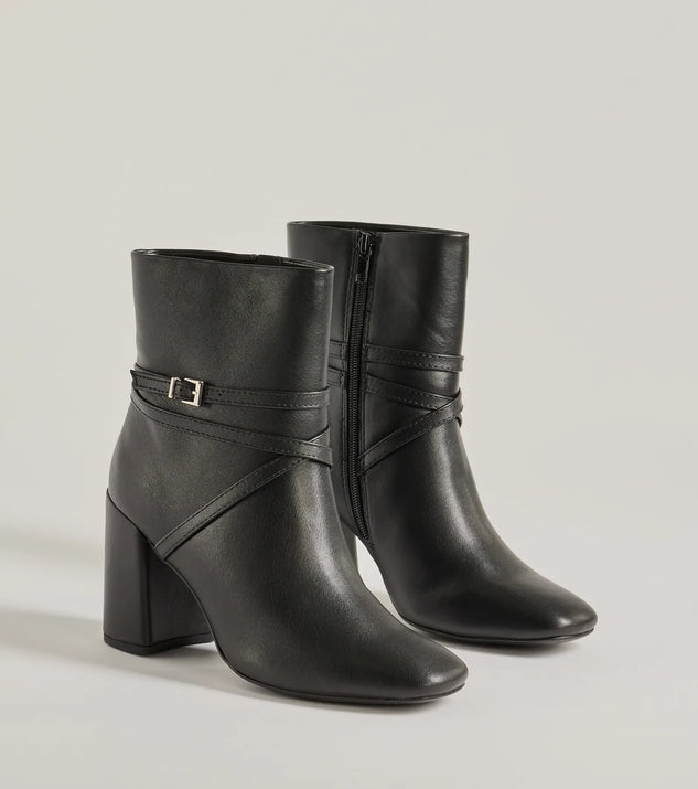 The Stylish Stride Strappy Faux Leather Booties are women's black shoes for work, featuring a sleek silhouette and cushioned sole for all-day comfort, and are a trendy choice for professional or business casual outfits.