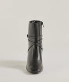 The Stylish Stride Strappy Faux Leather Booties are women's black shoes for work, featuring a sleek silhouette and cushioned sole for all-day comfort, and are a trendy choice for professional or business casual outfits.