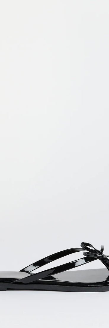 Elevate warm-weather looks with Dainty Looks Bow Thong Sandals in black, a pair of trendy sandals bringing chic, modern flair to every step.