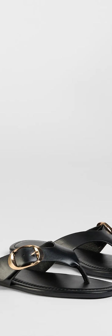 Elevate warm-weather looks with Statement Gleam Buckle Thong Sandals in black, a pair of trendy sandals bringing chic, modern flair to every step.