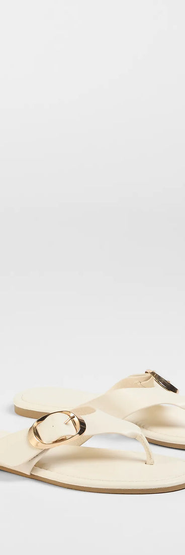 Style made simple with the Statement Gleam Buckle Thong Sandals in ivory, trendy women’s shoes that take your outfit from basic to bold in one step.