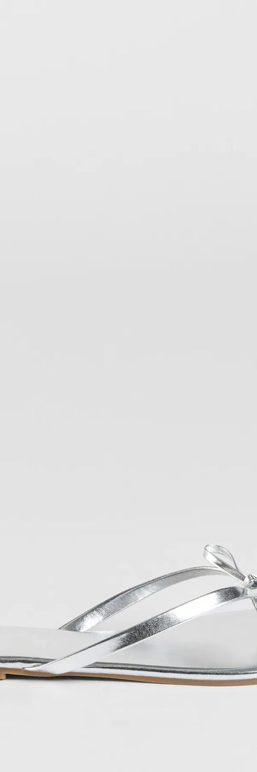 Elevate warm-weather looks with Perfect Pair Bow Detail Thong Strap Sandals in silver, a pair of trendy sandals bringing chic, modern flair to every step.