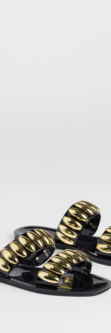 Elevate warm-weather looks with Such A Stud Strappy Jelly Sandals in gold, a pair of trendy sandals bringing chic, modern flair to every step.