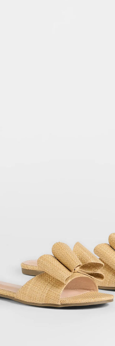 Elevate warm-weather looks with Charming Moves Woven Bow Sandals in natural, a pair of trendy sandals bringing chic, modern flair to every step.