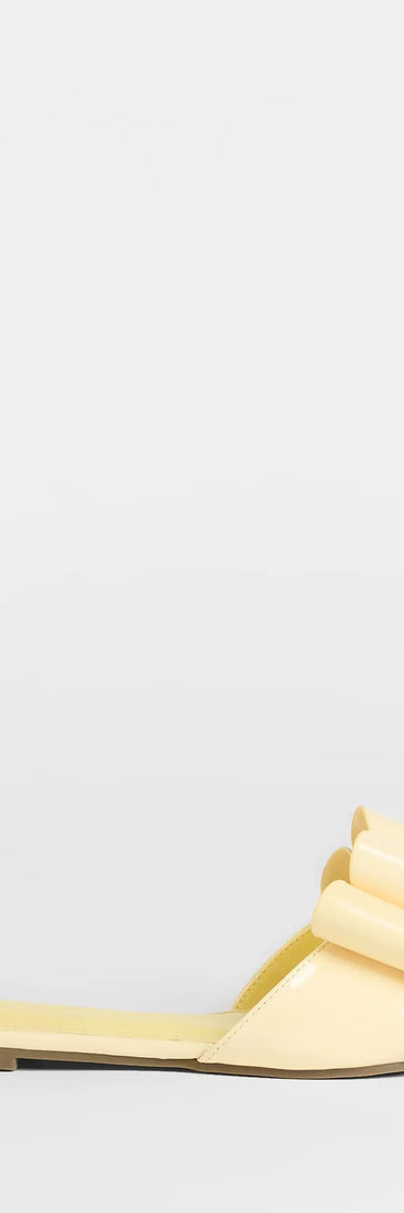 Elevate warm-weather looks with Charmed Intent Bow Sandals in yellow, a pair of trendy sandals bringing chic, modern flair to every step.