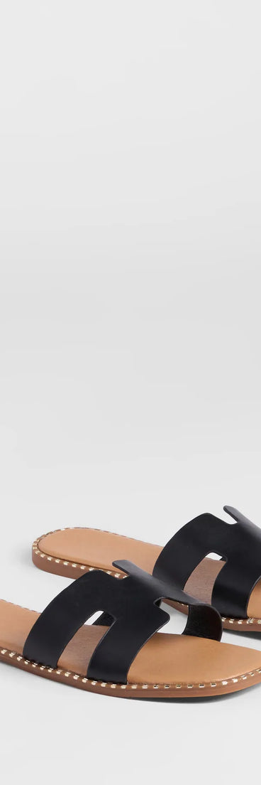 Stay on-trend this season with the Simply Chic Cutout Strap Flat Sandals in black, a must-have for creating stylish and effortless summer outfits for women.