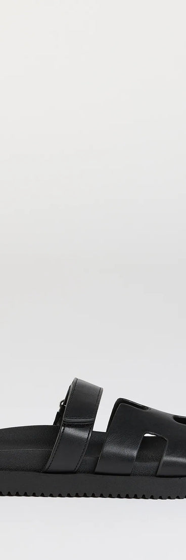 Elevate warm-weather looks with Sunny Vibe Cutout Strappy Slide Sandals in black, a pair of trendy sandals bringing chic, modern flair to every step.