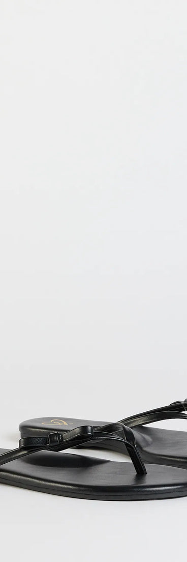 Elevate warm-weather looks with So Cute Bow Thong Sandals in black, a pair of trendy sandals bringing chic, modern flair to every step.