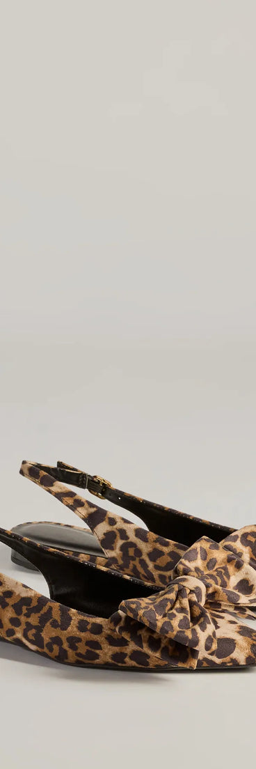 The Spotted Allure Leopard Print Bow Flats are women's leopard print shoes for work, featuring a sleek silhouette and cushioned sole for all-day comfort, and are a trendy choice for professional or business casual outfits.