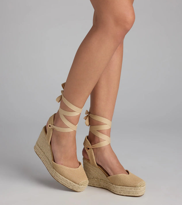 Elevate warm-weather looks with Weekend Getaway Lace-Up Espadrille Wedges in tan, a pair of trendy sandals bringing chic, modern flair to every step.