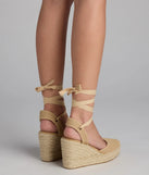 Elevate warm-weather looks with Weekend Getaway Lace-Up Espadrille Wedges in tan, a pair of trendy sandals bringing chic, modern flair to every step.