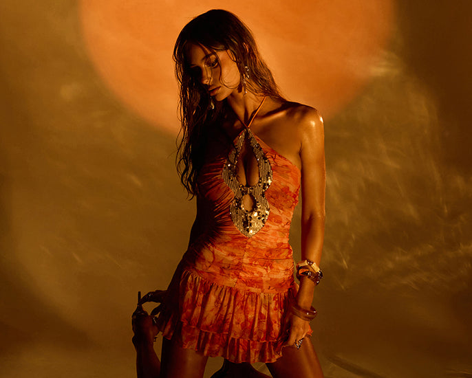 Moonlight Muse—shop club dresses featuring bold prints, playful ruffles, beaded details, and unforgettable nights out.