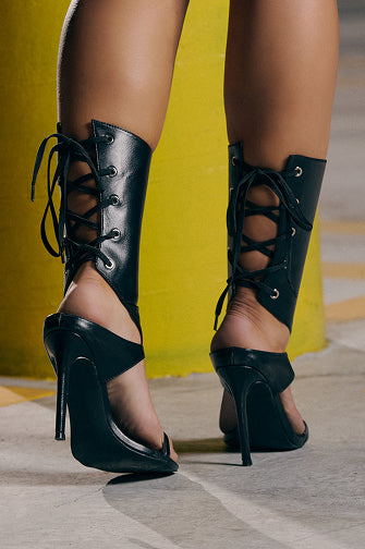 Discover heels that bring bold attitude with lace-up details, stiletto silhouettes, and bold hardware made to elevate every look.