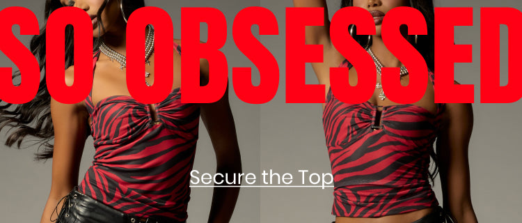Shop the Obsession Top featuring a bold zebra print, flattering ruching, and statement hardware made to turn heads.