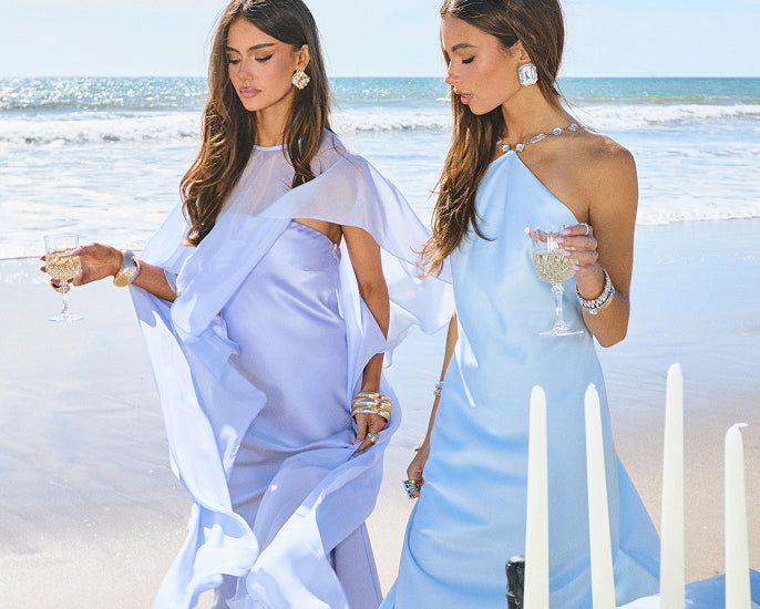 Shop wedding guest dresses for real love moments with fluid satin fabrics, soft pastel hues, and elegant draping.