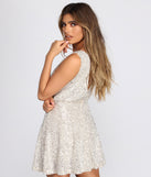Dakota Sequin Wrap Mini Dress creates the perfect summer wedding guest dress or cocktail party dresss with stylish details in the latest trends for 2023!