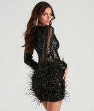 You’ll look fabulous in the Desirae Black Sequin Short Prom Dress with a feather hem and wispy feathers on the long sheer sleeves.