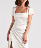 You'll be the best dressed in the Emelia Satin Puff Sleeve High Slit Formal Dress as your summer formal dress with unique details from Windsor.