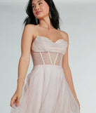 The corset top on the Ariel A-Line Pink Prom Dress in a pink glitter mesh for a sheer accent.
