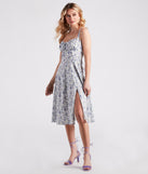 Floral Sunshine Corset Midi Dress creates the perfect summer wedding guest dress or cocktail party dresss with stylish details in the latest trends for 2023!