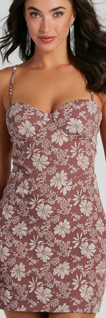 Essential for vacations or summer days, the Romance Era Floral Brocade Corset Mini Dress is a sundress or milkmaid dress with sleek and flirty details.