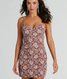 Essential for vacations or summer days, the Romance Era Floral Brocade Corset Mini Dress is a sundress or milkmaid dress with sleek and flirty details.