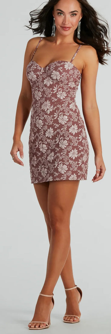 Essential for vacations or summer days, the Romance Era Floral Brocade Corset Mini Dress is a sundress or milkmaid dress with sleek and flirty details.