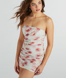 Essential for vacations or summer days, the She's A Dream Strapless Ruched Floral Mesh Mini Dress is a sundress or milkmaid dress with sleek and flirty details.