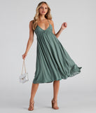 Palisades Ruched V-Neck Midi Dress creates the perfect spring wedding guest dress or cocktail attire with stylish details in the latest trends for 2023!