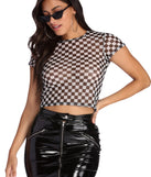 With fun and flirty details, Check On It Mesh Top shows off your unique style for a trendy outfit for the summer season!