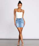 Essential Cami White Bodysuit Outfit styled with Denim Skirt and White Sandals